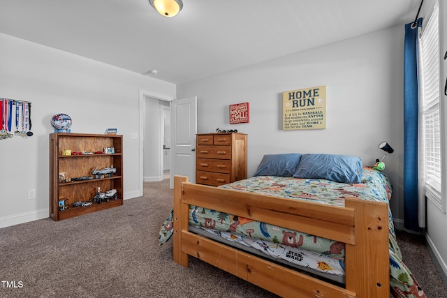 carpeted bedroom with baseboards