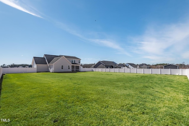 view of yard with a fenced backyard