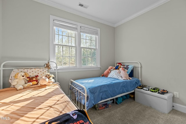 carpeted bedroom with crown molding and visible vents