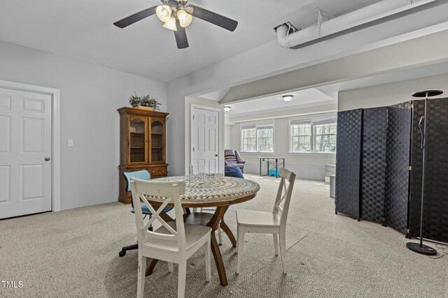 dining area with carpet flooring and ceiling fan