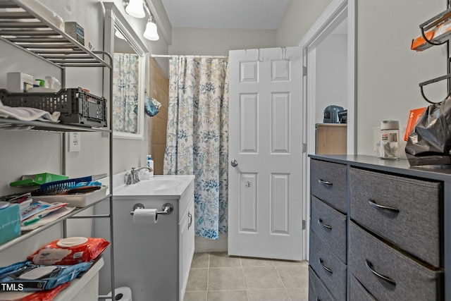 bathroom with tile patterned floors, vanity, and a shower with curtain