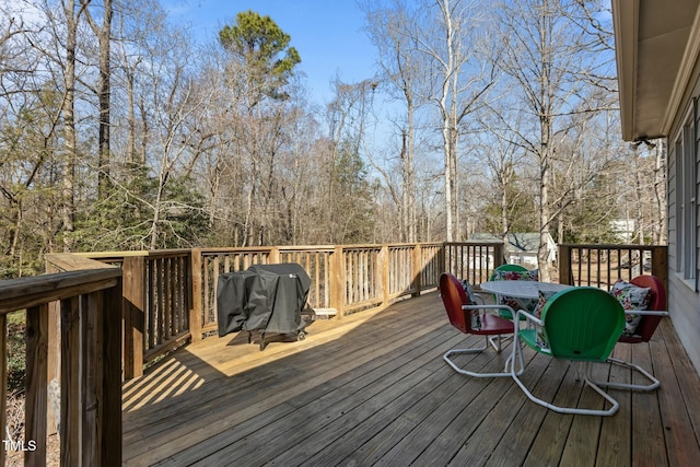 wooden deck featuring area for grilling