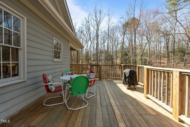 wooden deck featuring area for grilling