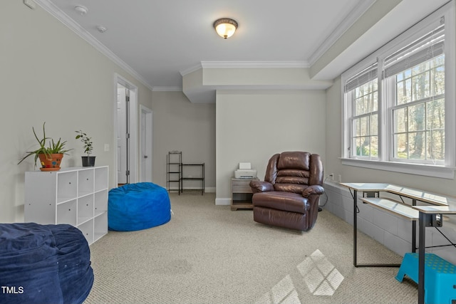 sitting room with baseboards, carpet floors, and ornamental molding