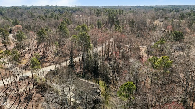 birds eye view of property with a view of trees