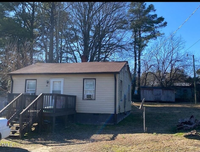 view of front of house featuring crawl space and a wooden deck