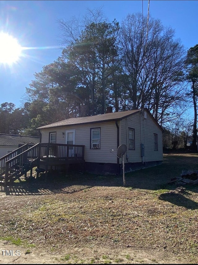 view of front of house featuring a deck and crawl space