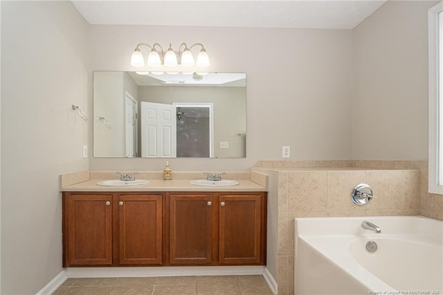 full bathroom with tile patterned floors, double vanity, a sink, and a bath