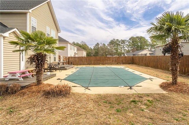 view of swimming pool featuring a patio area, a fenced backyard, and a fenced in pool