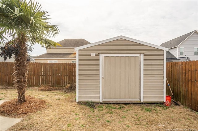 view of shed with a fenced backyard