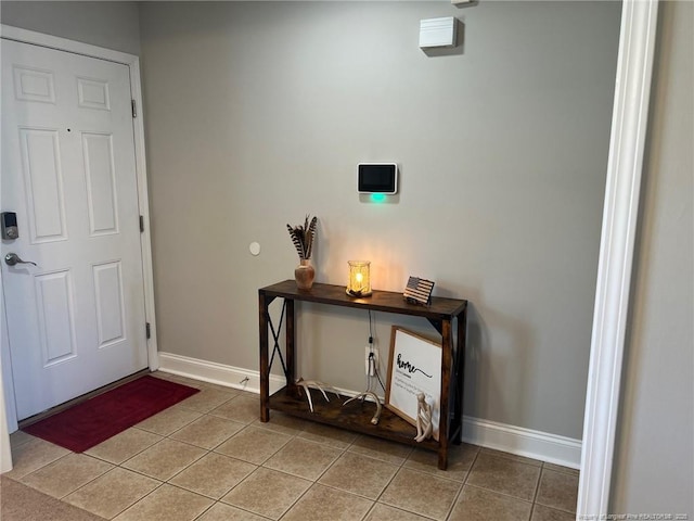 office space featuring light tile patterned flooring and baseboards