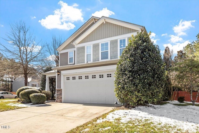 view of front of house with a garage, driveway, and board and batten siding