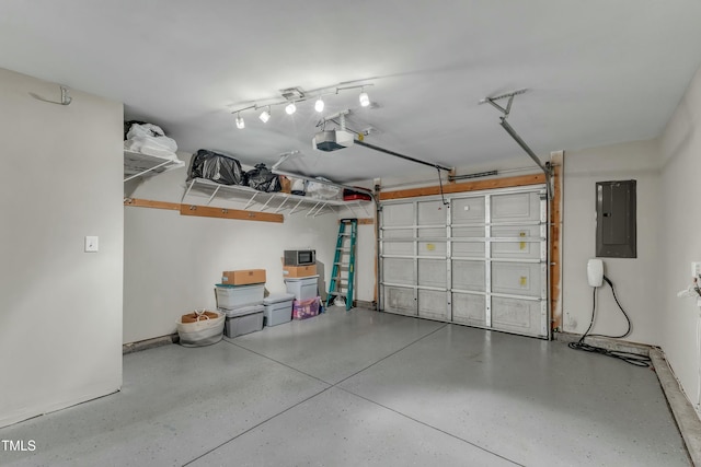 garage featuring electric panel and a garage door opener