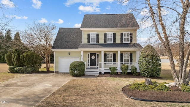 colonial house with a garage, concrete driveway, a porch, and roof with shingles