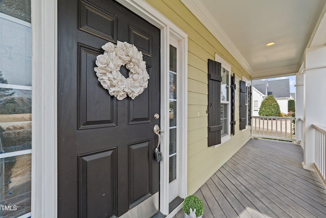 doorway to property featuring covered porch