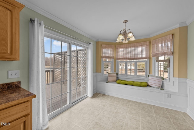 sunroom featuring a chandelier and a wealth of natural light