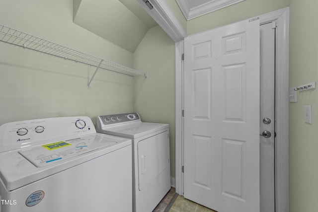 washroom with washing machine and dryer, laundry area, and crown molding