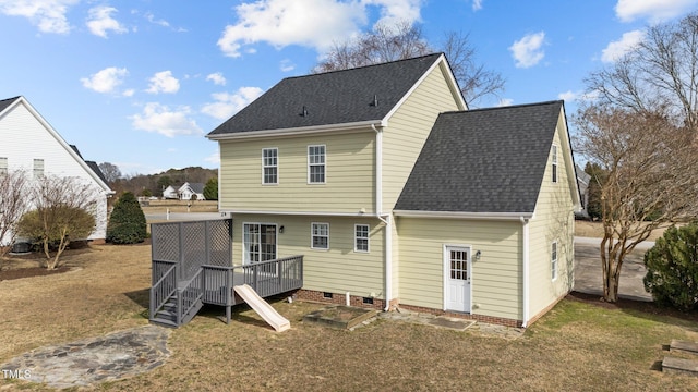 back of house featuring a shingled roof, crawl space, a yard, and a deck