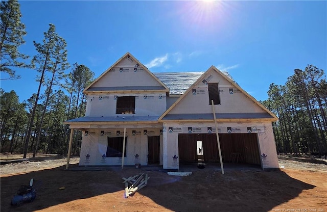 unfinished property featuring a garage