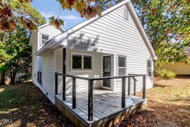 back of property with a wooden deck