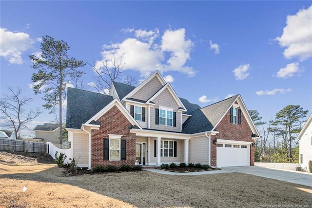 view of front facade featuring a garage, fence, concrete driveway, and brick siding