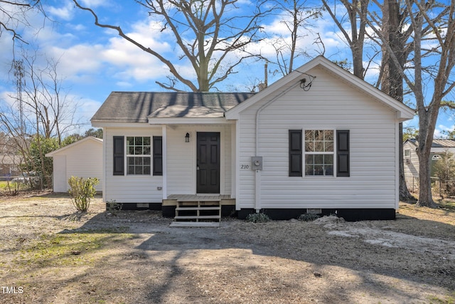 view of front of home with a shingled roof