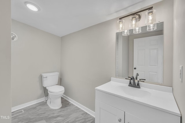 half bathroom with baseboards, visible vents, toilet, marble finish floor, and vanity