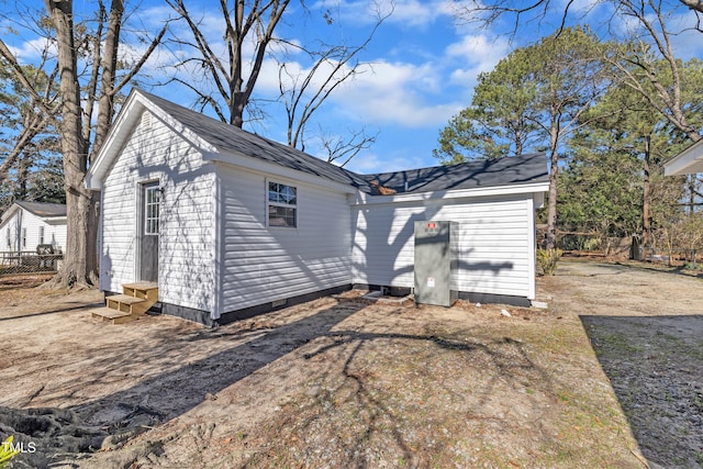 exterior space featuring entry steps, crawl space, and an outdoor structure