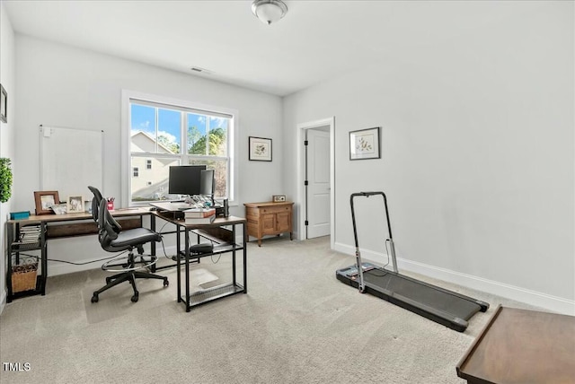 office with visible vents, baseboards, and carpet flooring