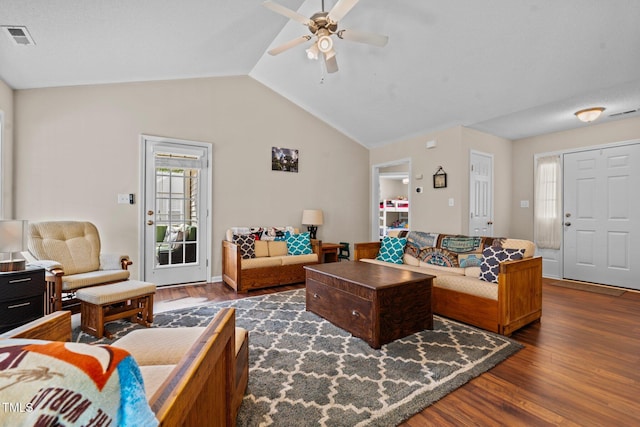 living room featuring lofted ceiling, dark wood-style floors, ceiling fan, and visible vents