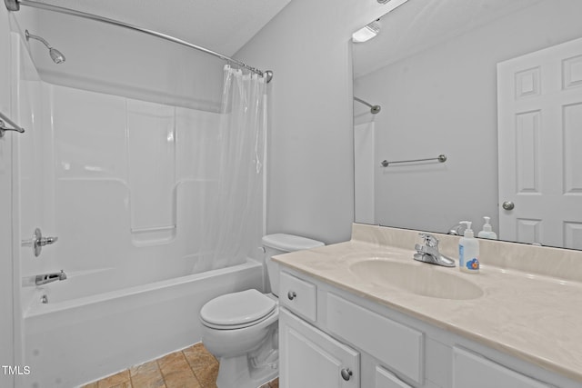 full bath with shower / bath combo, vanity, toilet, and a textured ceiling