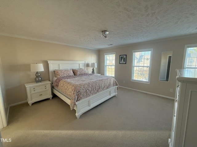 bedroom with baseboards, ornamental molding, and carpet flooring