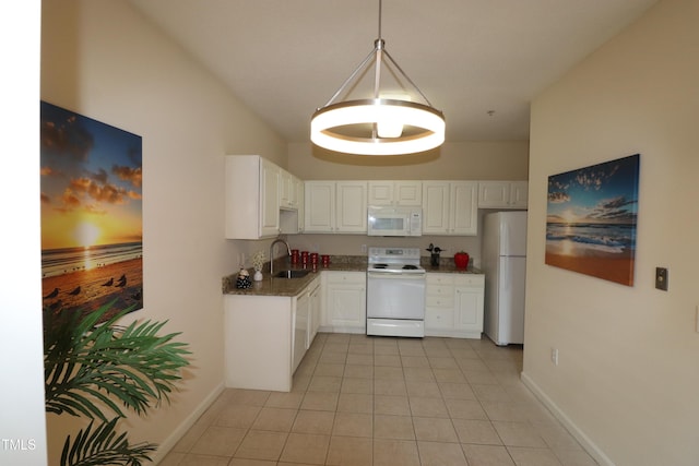 kitchen with white appliances, baseboards, white cabinets, a sink, and light tile patterned flooring