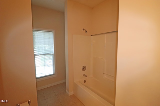 full bathroom featuring tub / shower combination, tile patterned flooring, and baseboards