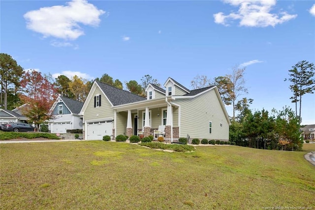 view of front facade featuring a garage, covered porch, and a front yard