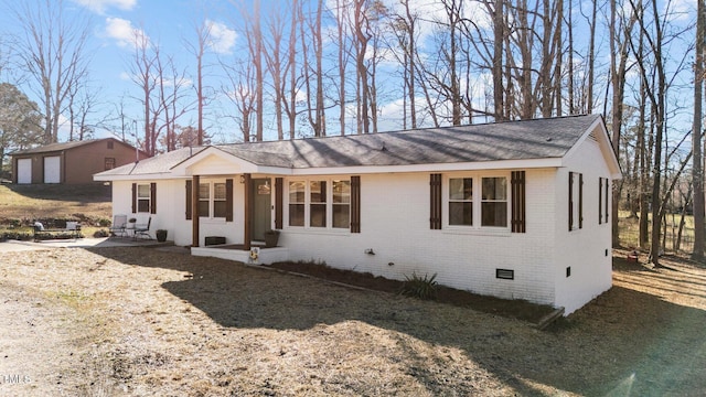 ranch-style house with a patio area, crawl space, and brick siding