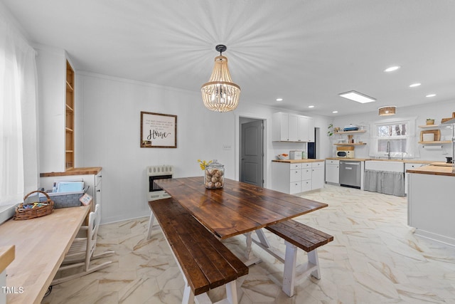 dining space featuring heating unit, marble finish floor, and recessed lighting