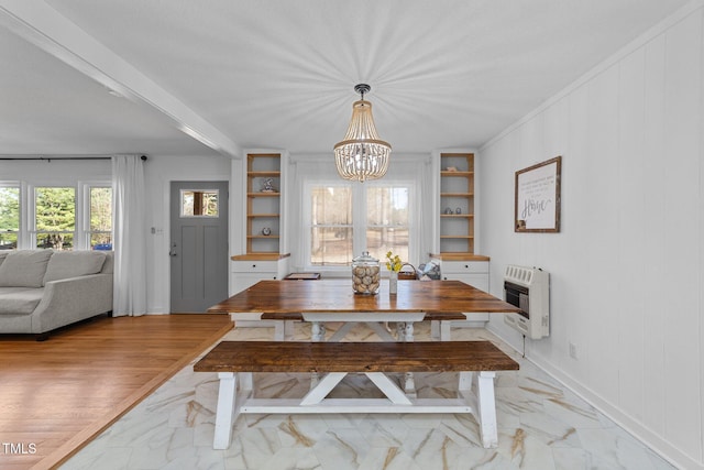 dining area with heating unit, marble finish floor, baseboards, and a chandelier