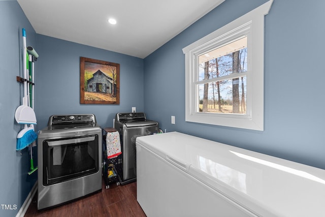 laundry room featuring laundry area, separate washer and dryer, dark wood-type flooring, and recessed lighting