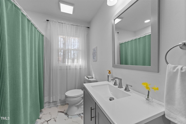 bathroom featuring marble finish floor, a shower with shower curtain, vanity, and toilet