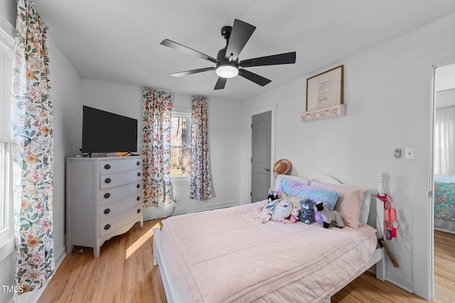 bedroom featuring wood finished floors and a ceiling fan