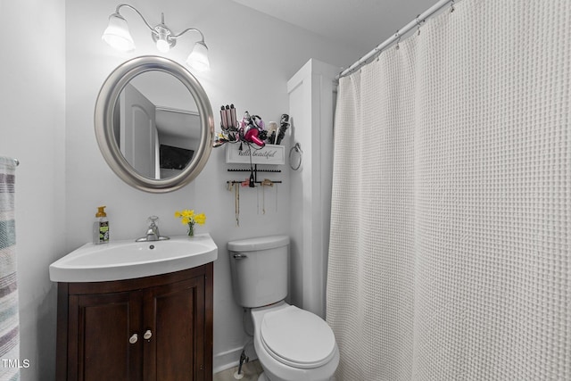 bathroom featuring toilet and vanity