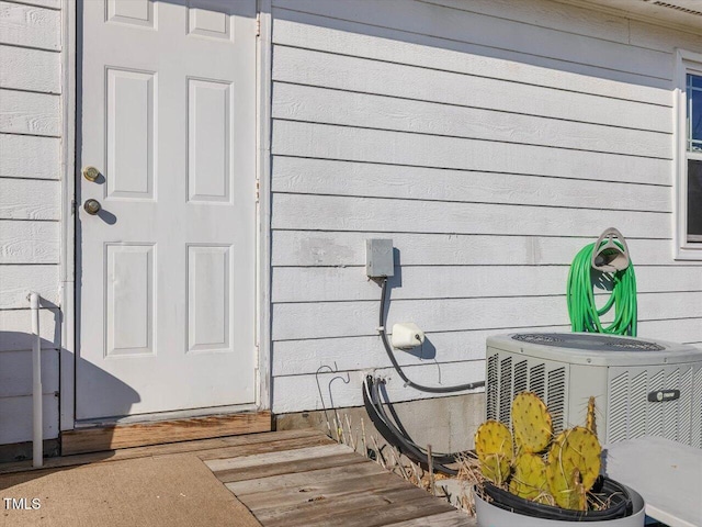 entrance to property with central AC unit