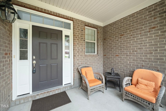 property entrance with brick siding