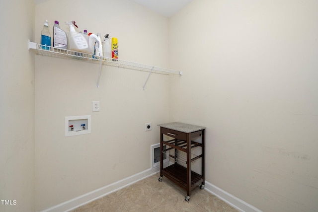 clothes washing area featuring laundry area, baseboards, washer hookup, and electric dryer hookup