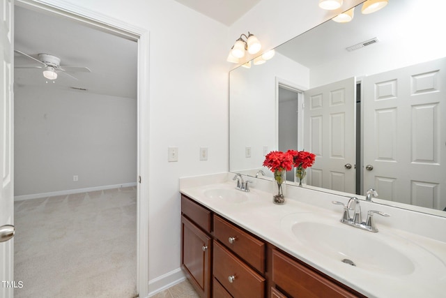 bathroom featuring double vanity, a sink, visible vents, and a ceiling fan