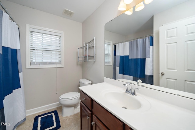 full bathroom with tile patterned flooring, toilet, vanity, visible vents, and baseboards