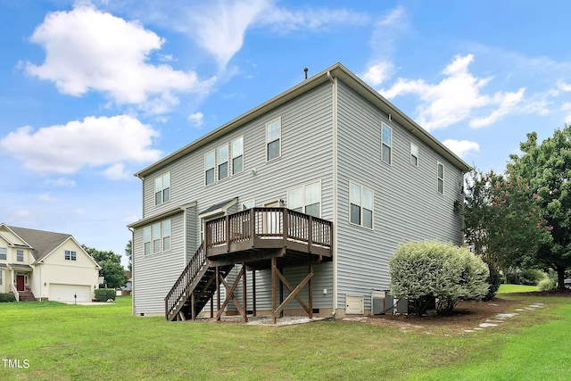 rear view of house with a yard, crawl space, a deck, a garage, and stairs