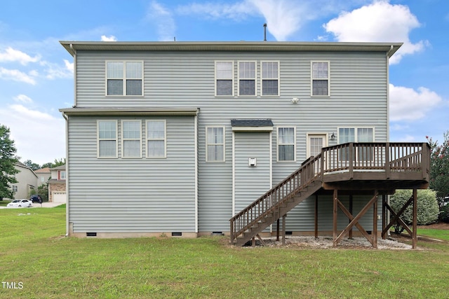 back of property with crawl space, a lawn, stairway, and a wooden deck