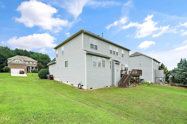 rear view of property with stairs, a yard, crawl space, and a wooden deck